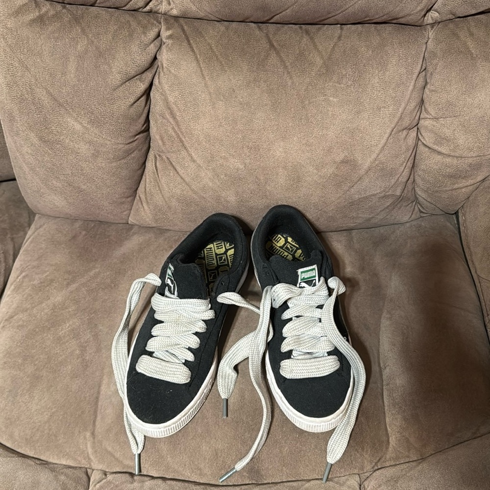 Black, grey, and white Pumas.